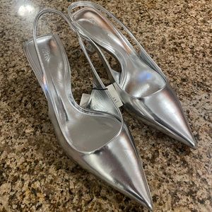 Pointed toe silver heels